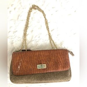 Sondra Robert’s linen & brown leather clutch handbag gold chain